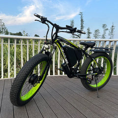GOGOBEST GF700 electric bike in black and neon green, side view on outdoor deck