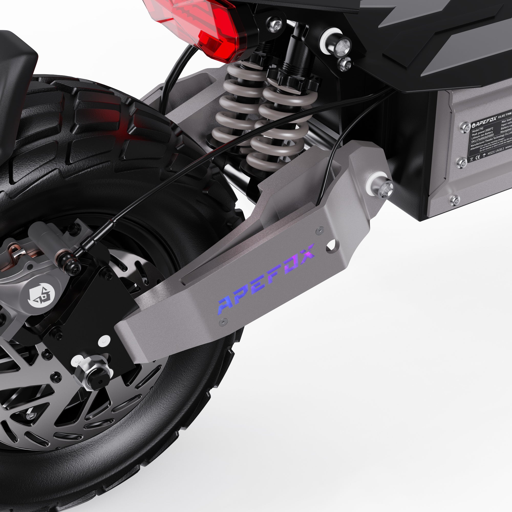 Close-up of a motorcycle suspension system with 'APEFOX' branding on a white background