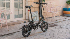 Fiido D3 Pro electric bike in black, side view, parked on a cobblestone street