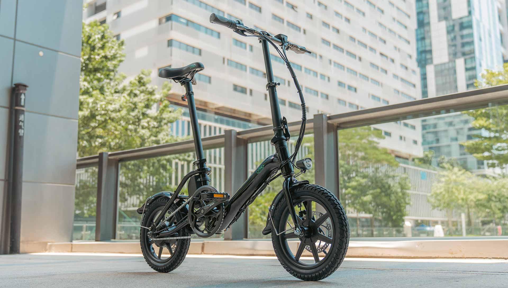 Fiido D3 Pro electric bike with mudguard and front light in black, side view, urban setting