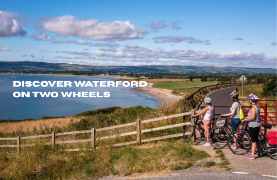 Cyclists with electric bikes on a scenic coastal trail in Waterford, sunny day, side view