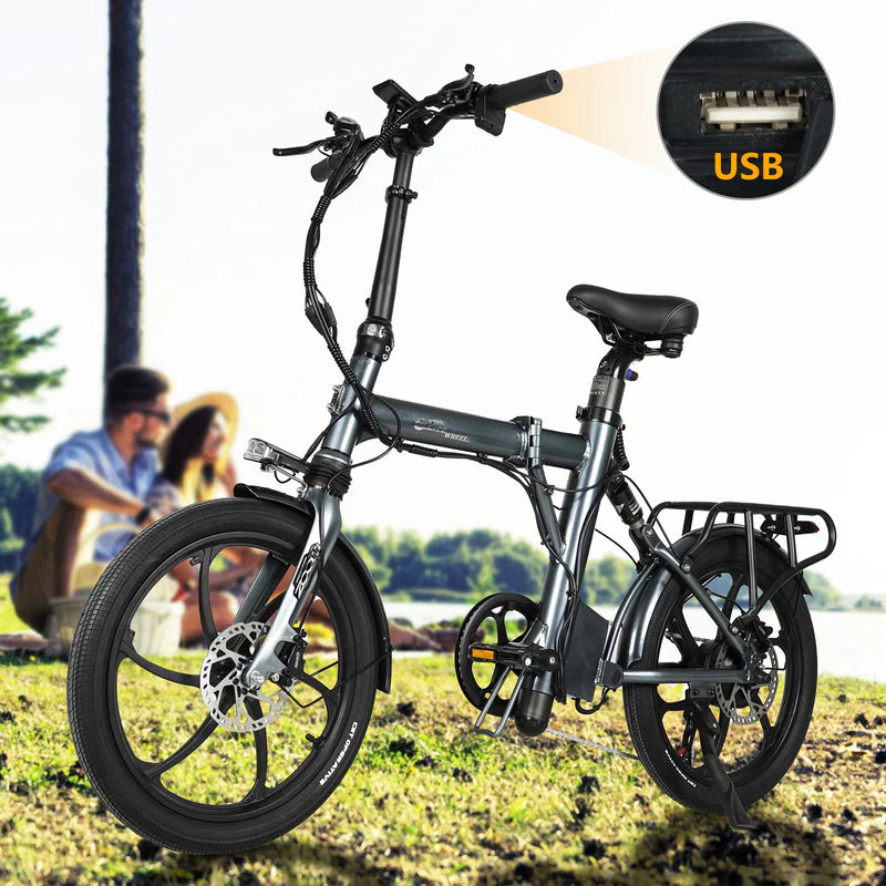 Foldable CMACEWHEEL EM20 Electric Bike with USB port on a grassy background
