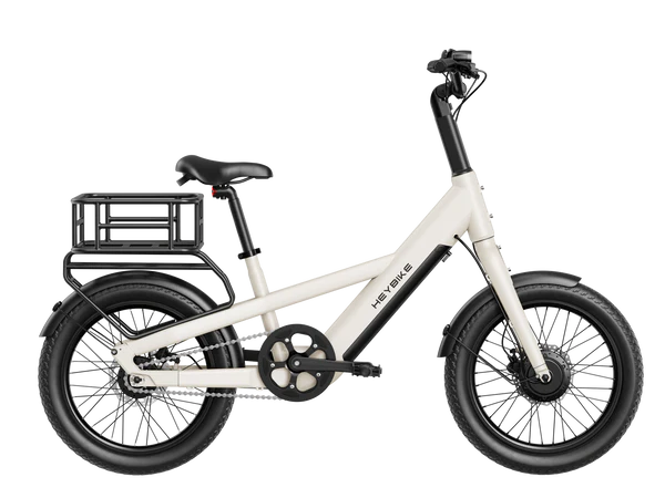 White children's bike with black wheels and a small basket on a white background